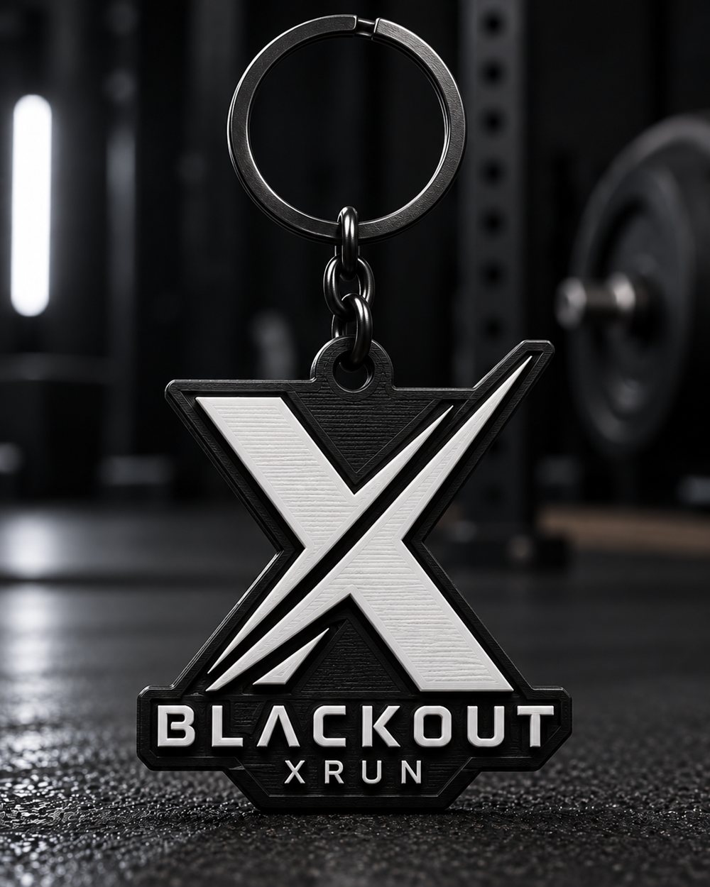 Chaveiro em formato de X da Blackout X Run, preto e branco